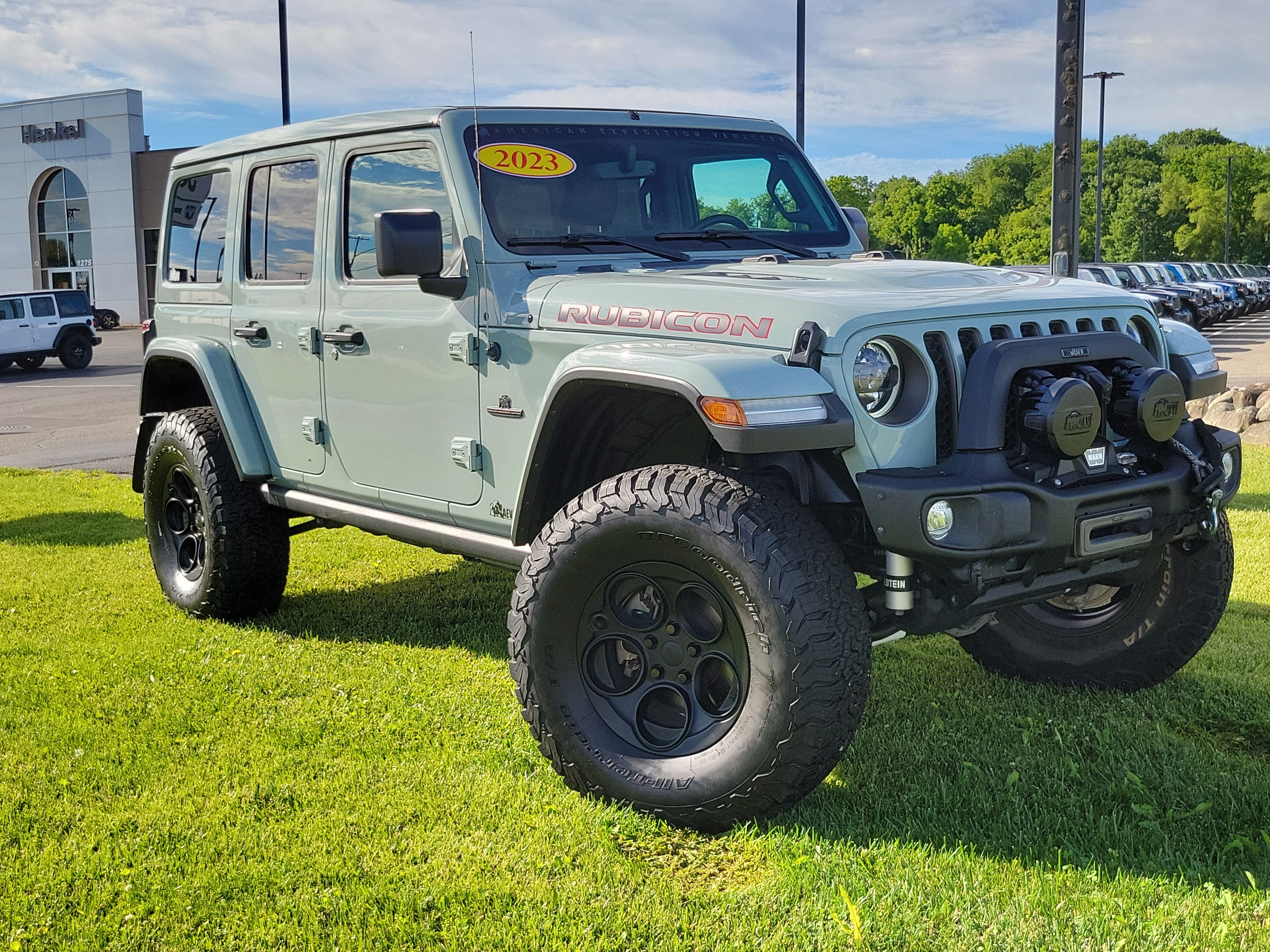 2023 Jeep Wrangler 4-Door Rubicon 4x4 in Earl Clearcoat — front three-quarter view