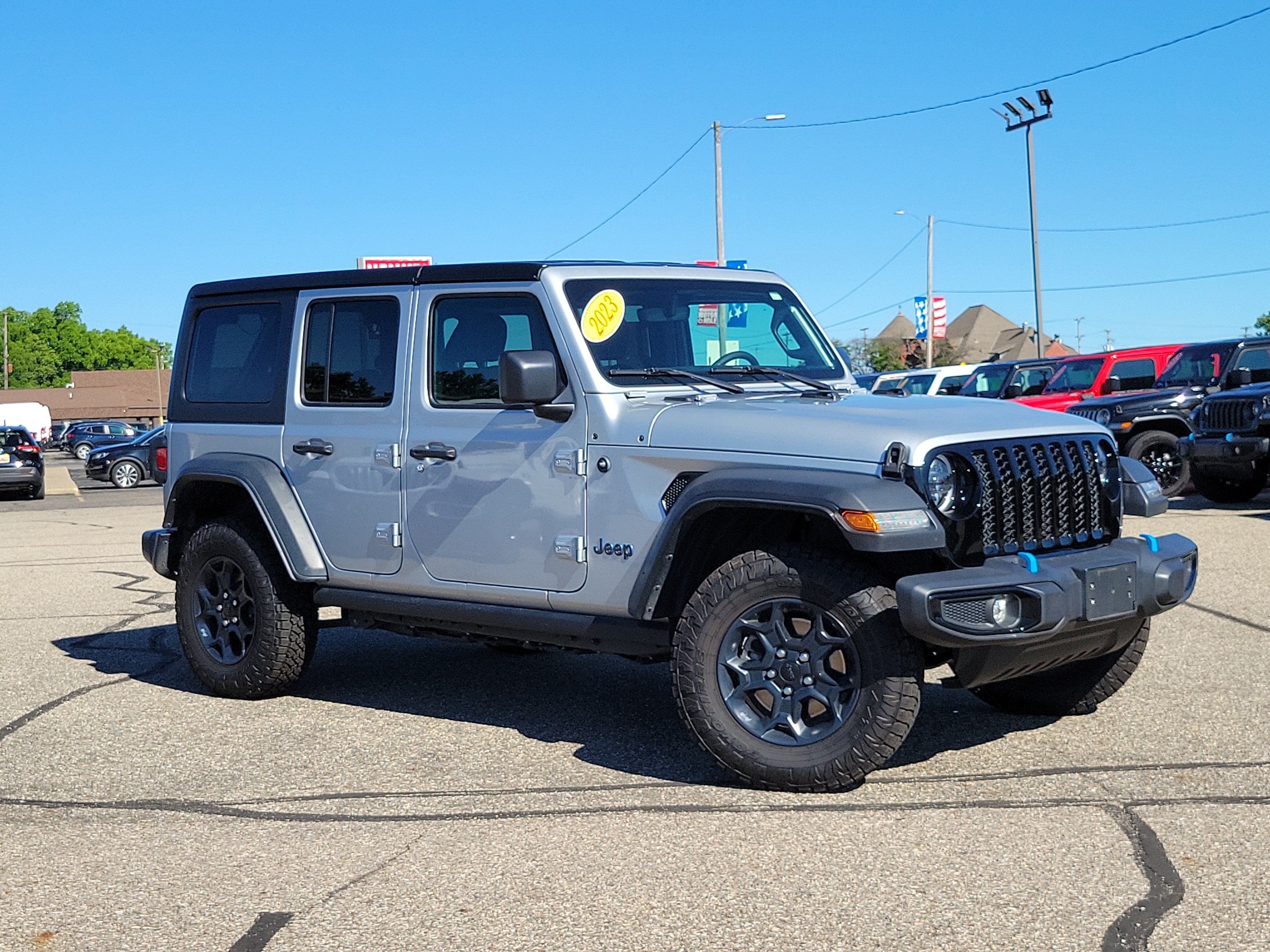 2023 Jeep Wrangler 4xe 4x4 in Silver Zynith Clearcoat — front three-quarter view