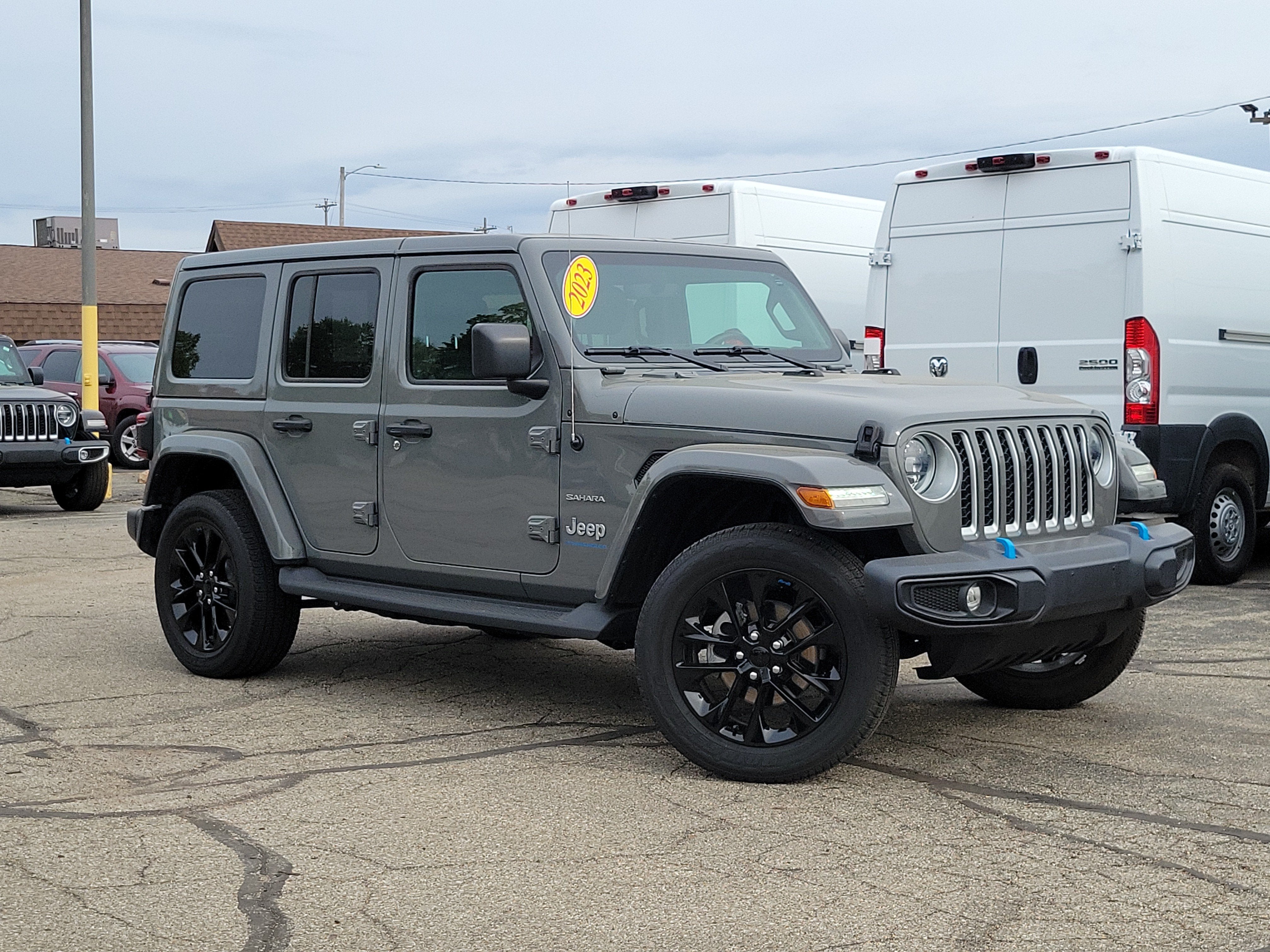 2023 Jeep Wrangler 4xe Sahara 4x4 in Sting-Gray Clearcoat — front three-quarter view
