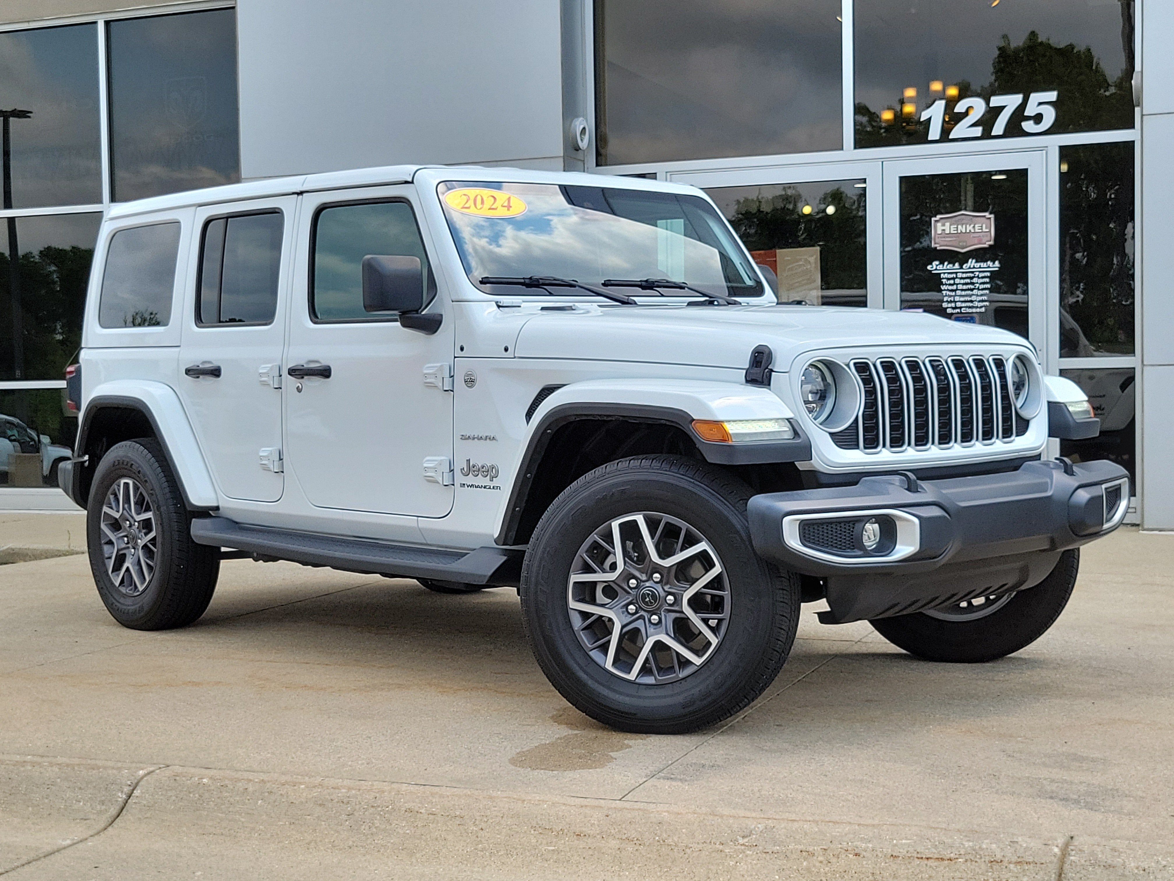 2024 Jeep Wrangler 4-Door Sahara 4x4 in Bright White Clearcoat — front three-quarter view