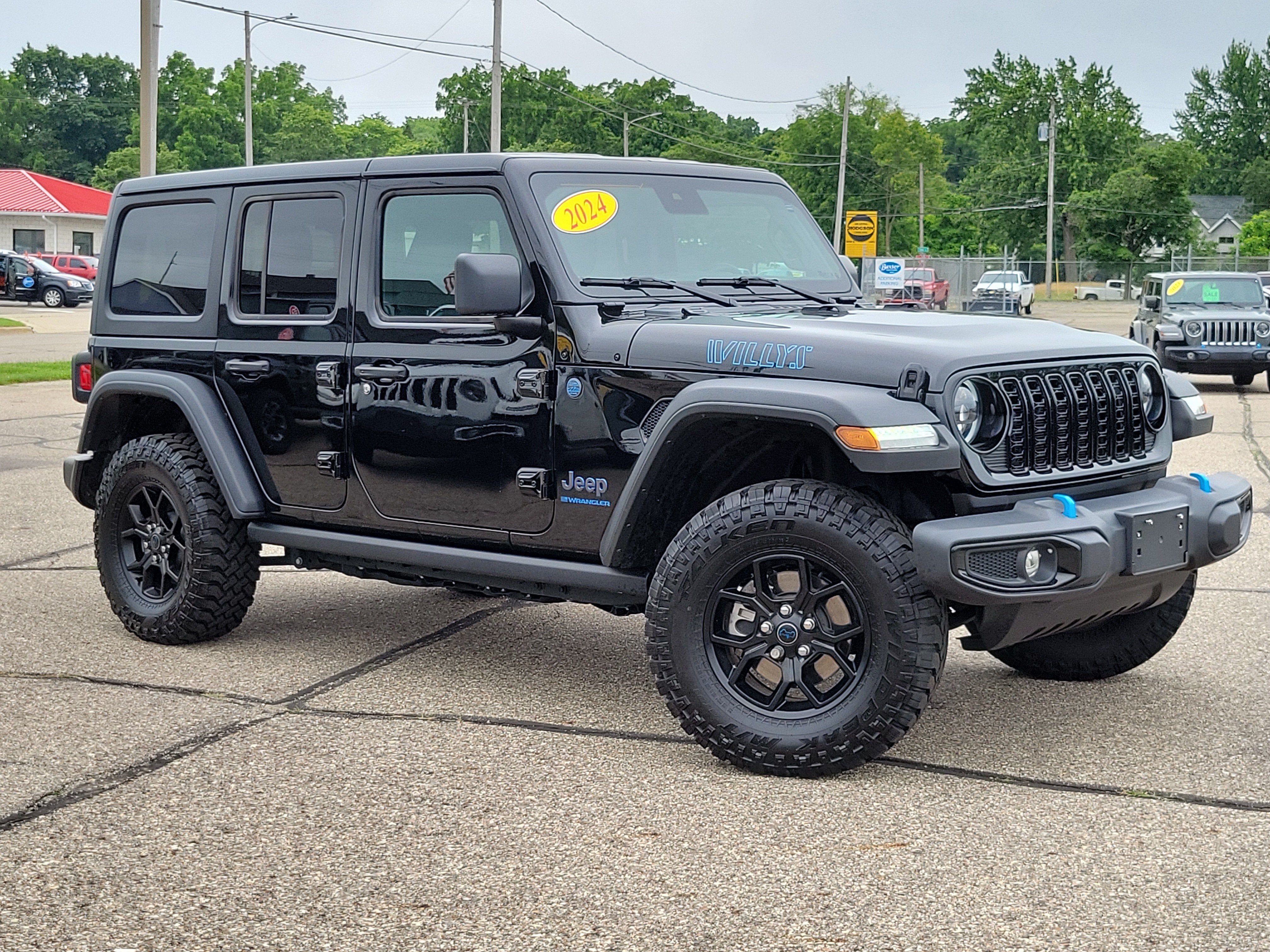 2024 Jeep Wrangler 4xe Willys 4xe in Black Clearcoat — front three-quarter view
