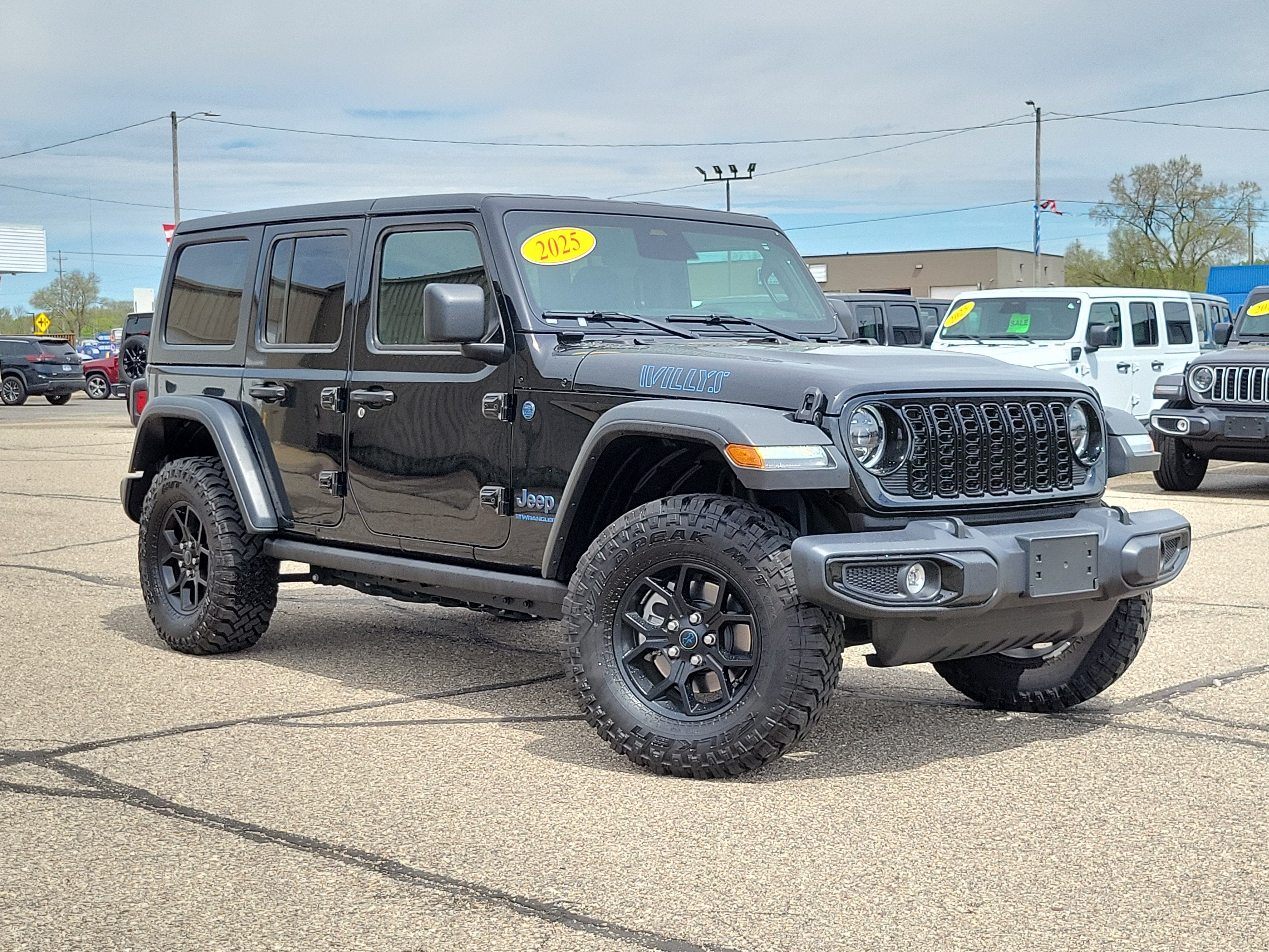 2025 Jeep Wrangler 4xe Willys 4xe in Black Clearcoat — front three-quarter view