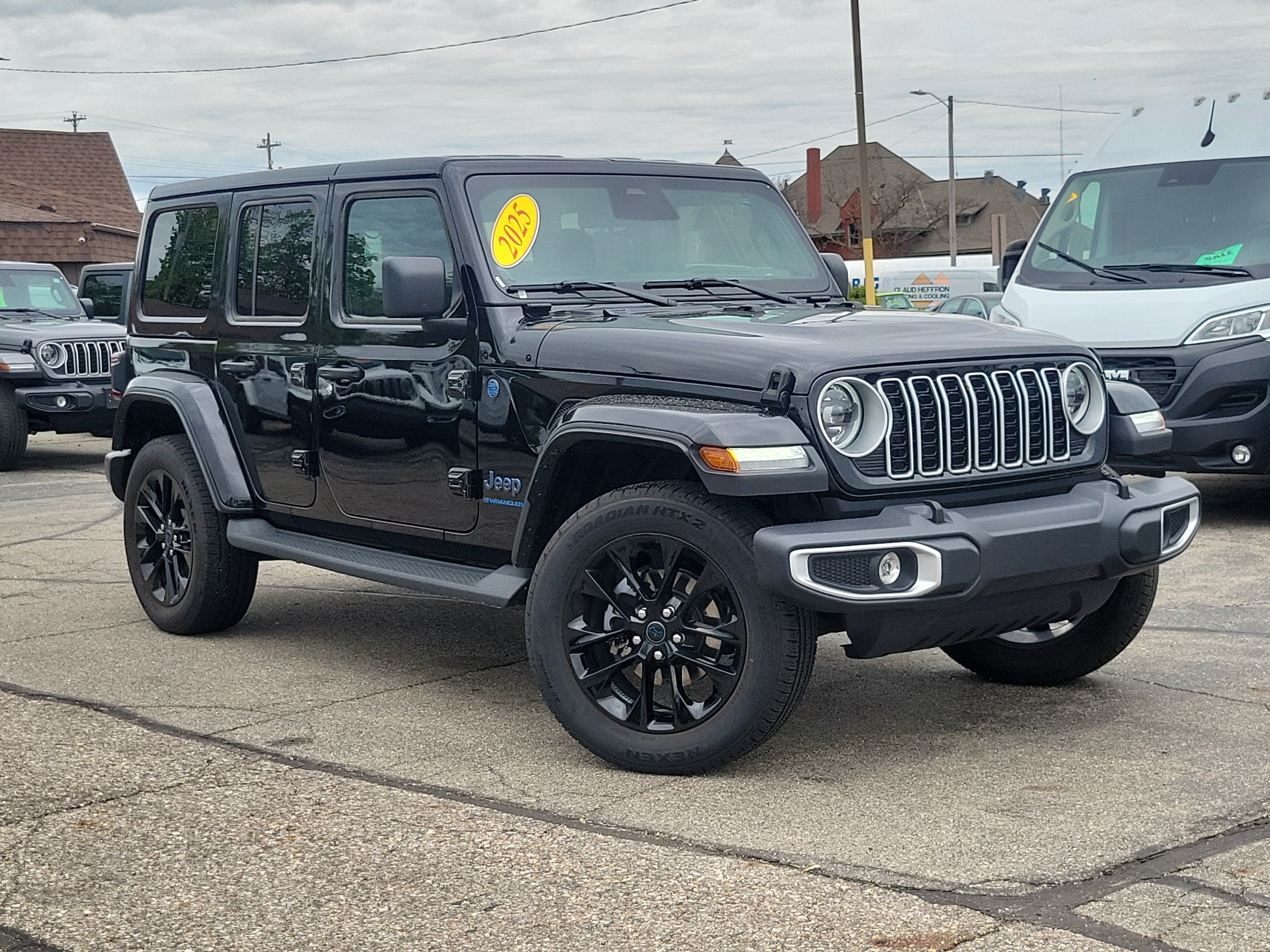2025 Jeep Wrangler 4xe Sahara 4xe in Black Clearcoat — front three-quarter view