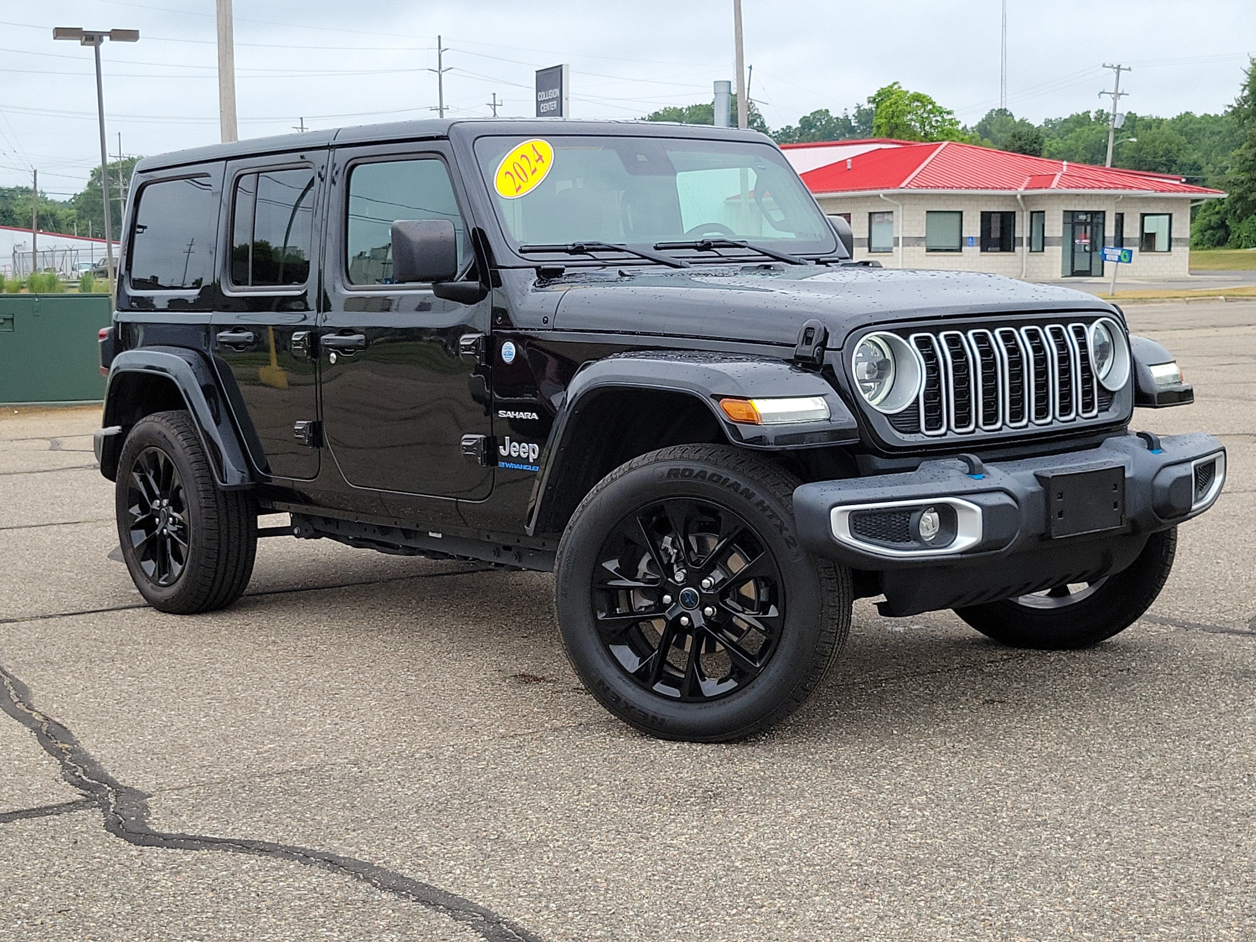 2024 Jeep Wrangler 4xe Sahara 4xe in Black Clearcoat — front three-quarter view