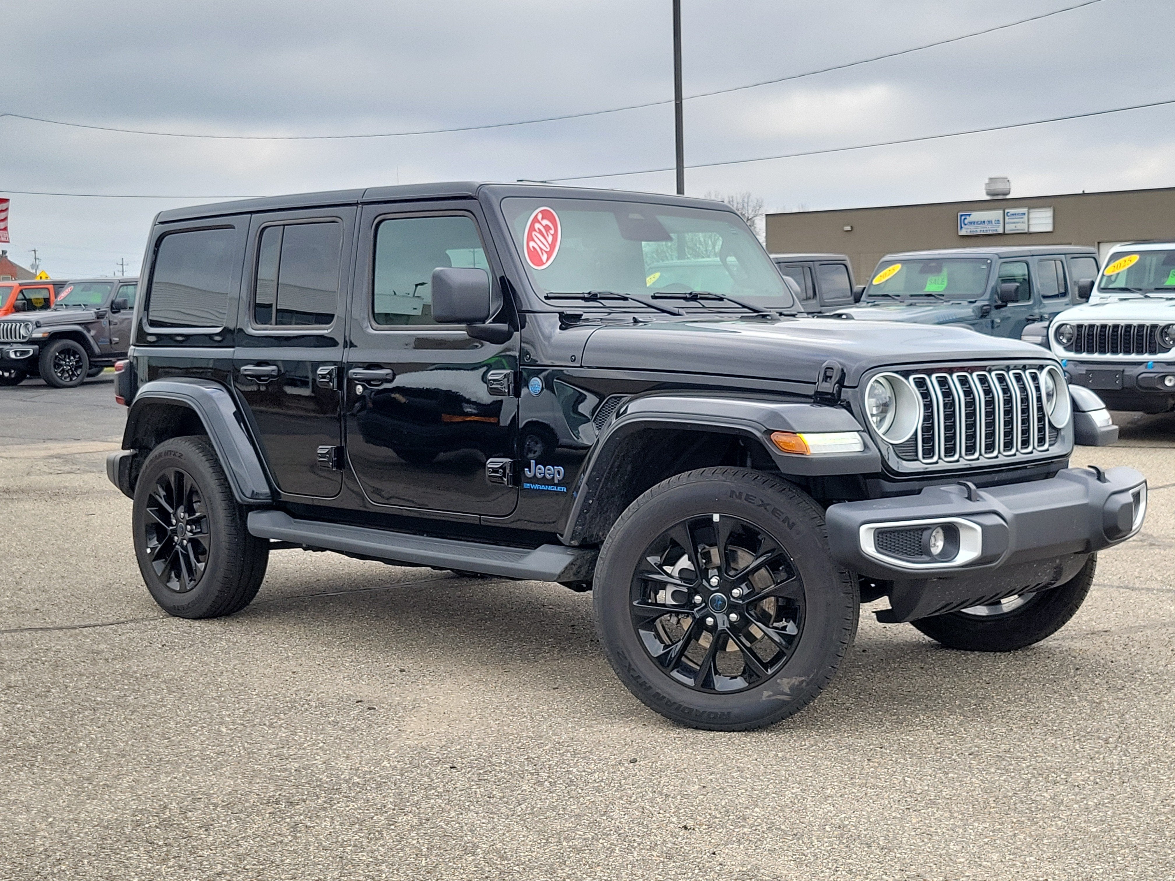 2025 Jeep Wrangler 4xe Sahara 4xe in Black Clearcoat — front three-quarter view