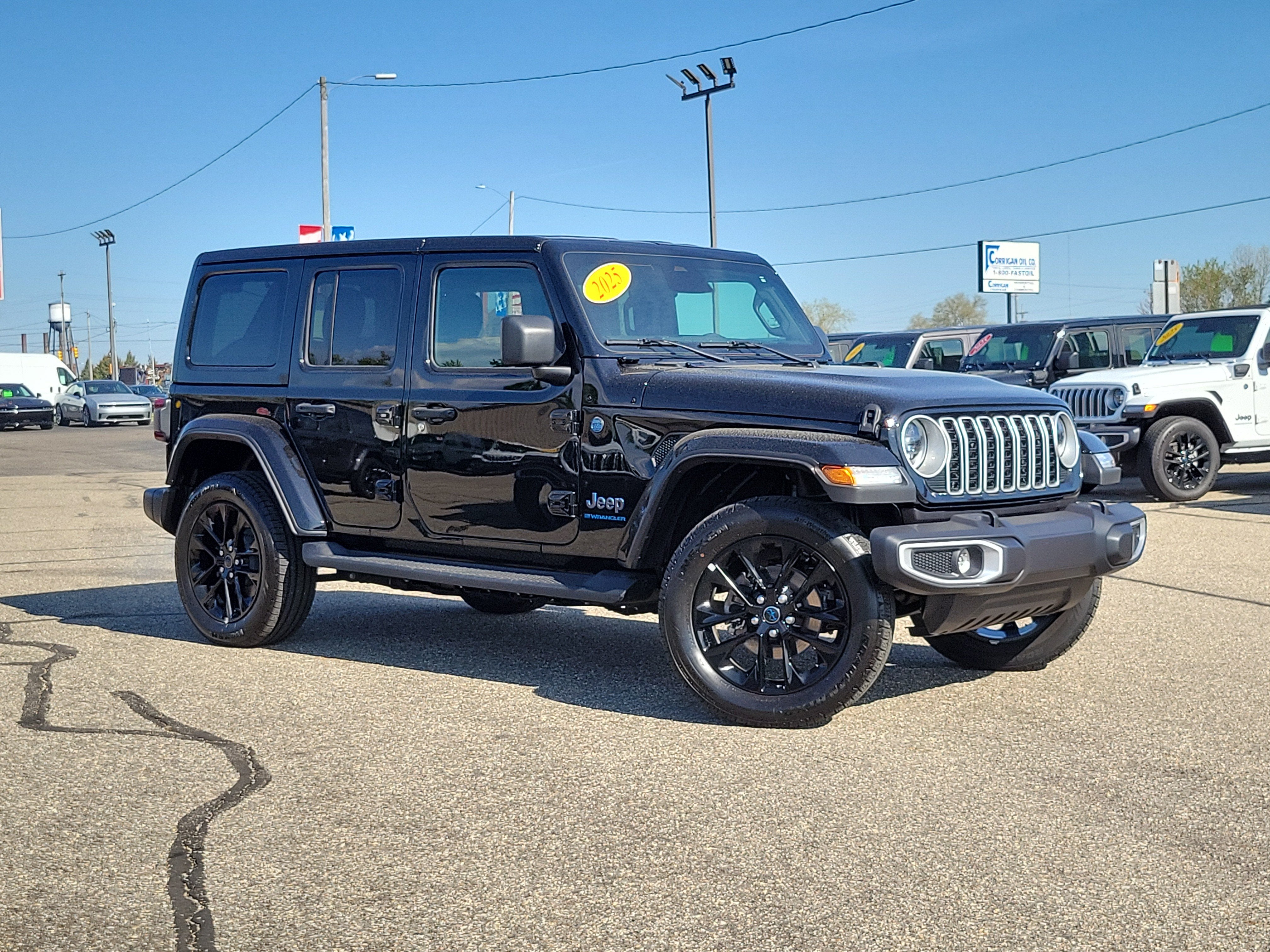 2025 Jeep Wrangler 4xe Sahara 4xe in Black Clearcoat — front three-quarter view
