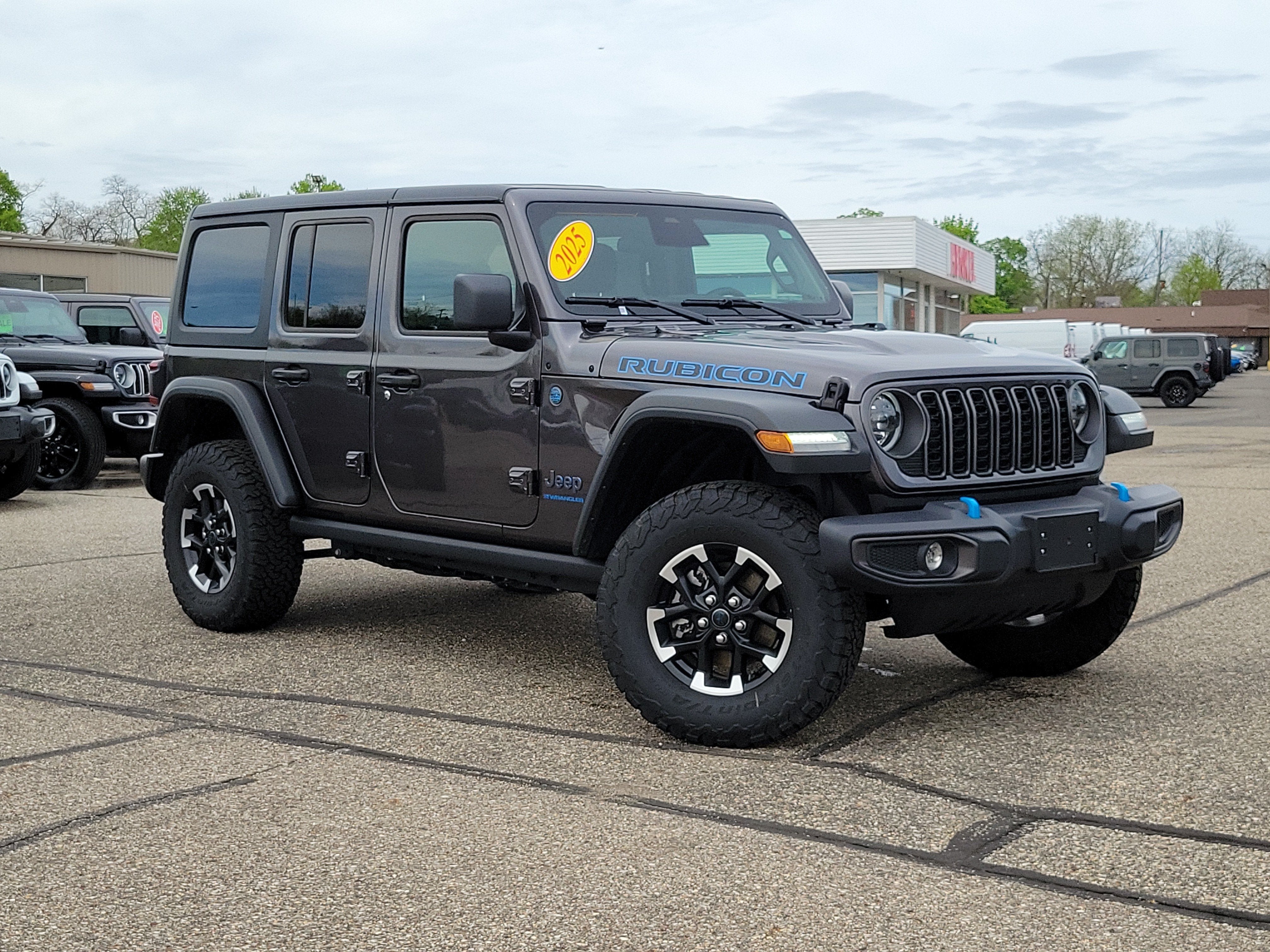 2025 Jeep Wrangler 4xe Rubicon 4xe in Granite Crystal Metallic Clearcoat — front three-quarter view