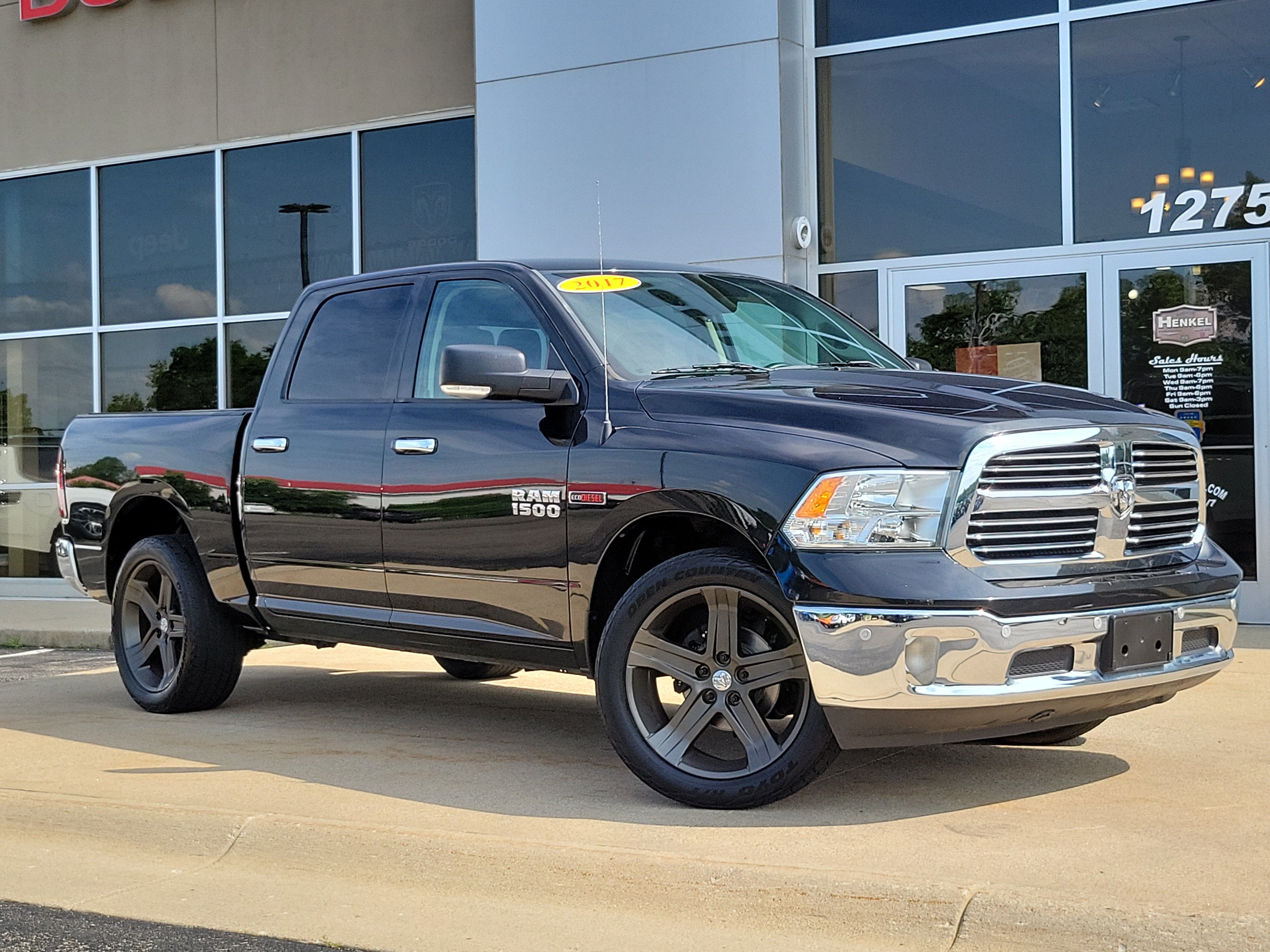 2017 RAM 1500 Big Horn Crew Cab 4x4 5'7' Box in Brilliant Black Crystal Pearlcoat — front three-quarter view