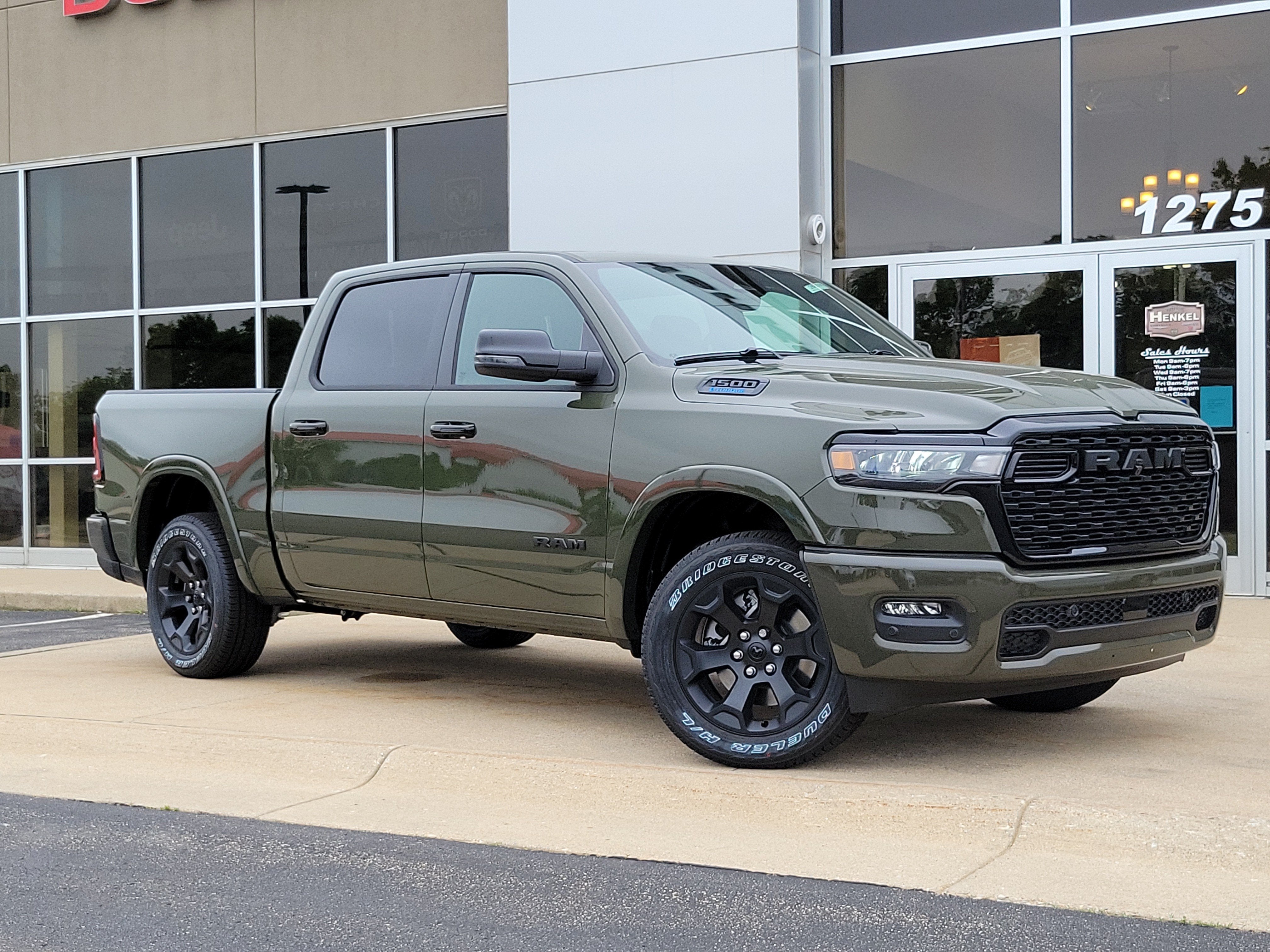 2026 RAM Ram 1500 RAM 1500 BIG HORN CREW CAB 4X4 5'7' BOX in Tank Exterior Paint — front three-quarter view