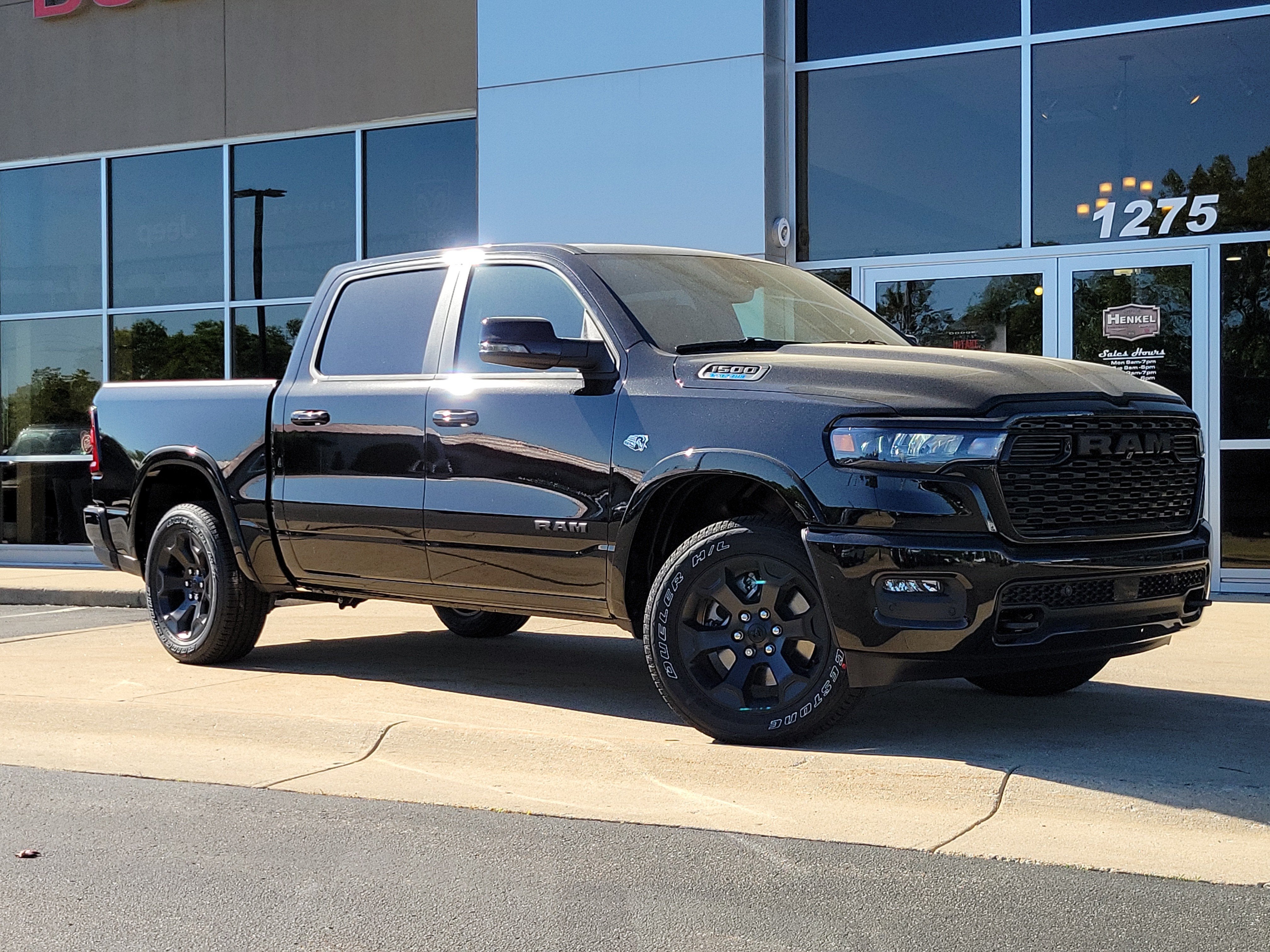 2026 RAM Ram 1500 RAM 1500 BIG HORN CREW CAB 4X4 5'7' BOX in Diamond Black Crystal Pearl-Coat Exterior Paint — front three-quarter view