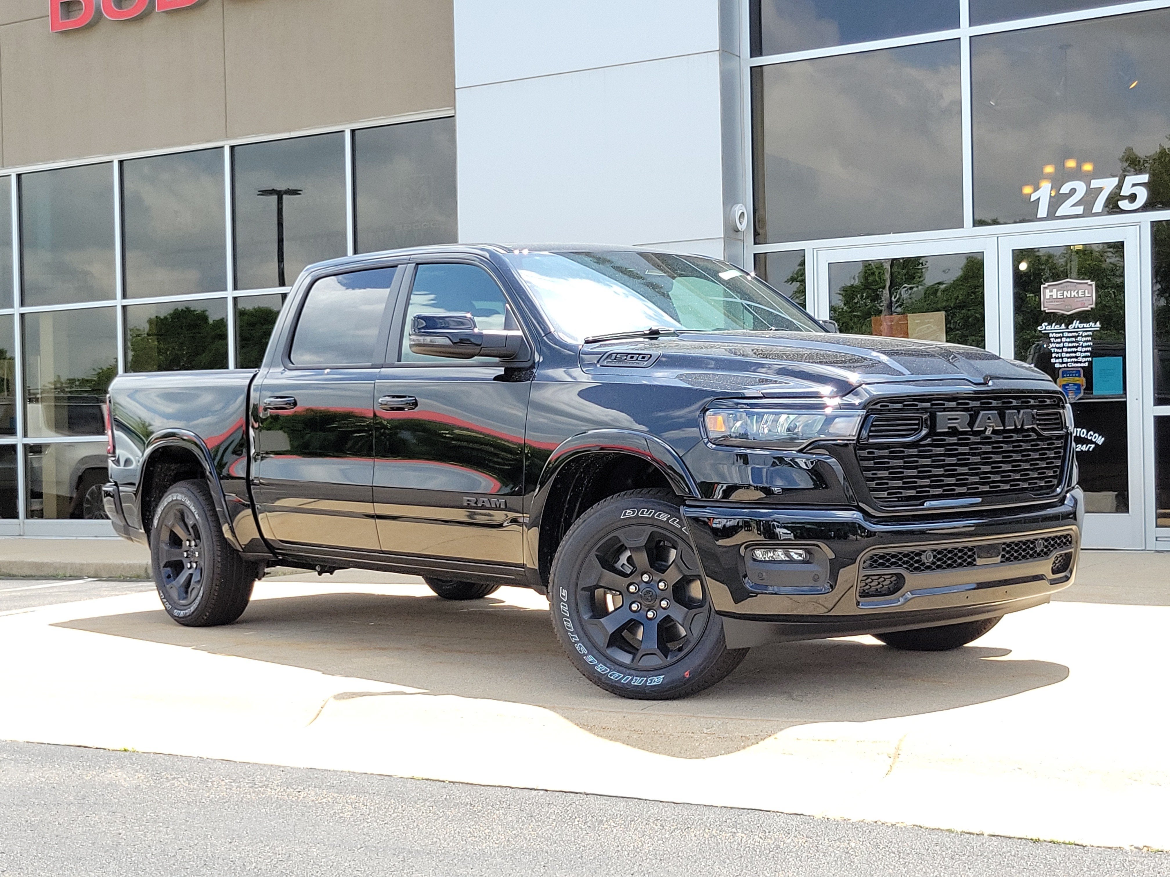 2026 RAM Ram 1500 RAM 1500 BIG HORN CREW CAB 4X4 5'7' BOX in Diamond Black Crystal Pearl-Coat Exterior Paint — front three-quarter view