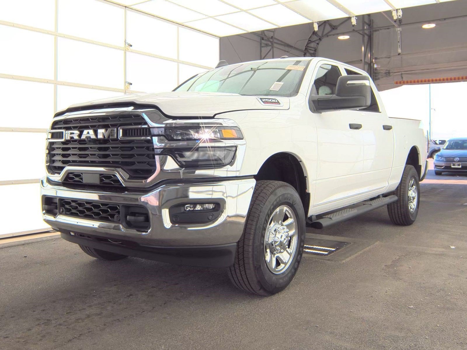 2025 RAM 2500 Tradesman Crew Cab 4x4 6'4' Box in Bright White Clearcoat — front three-quarter view