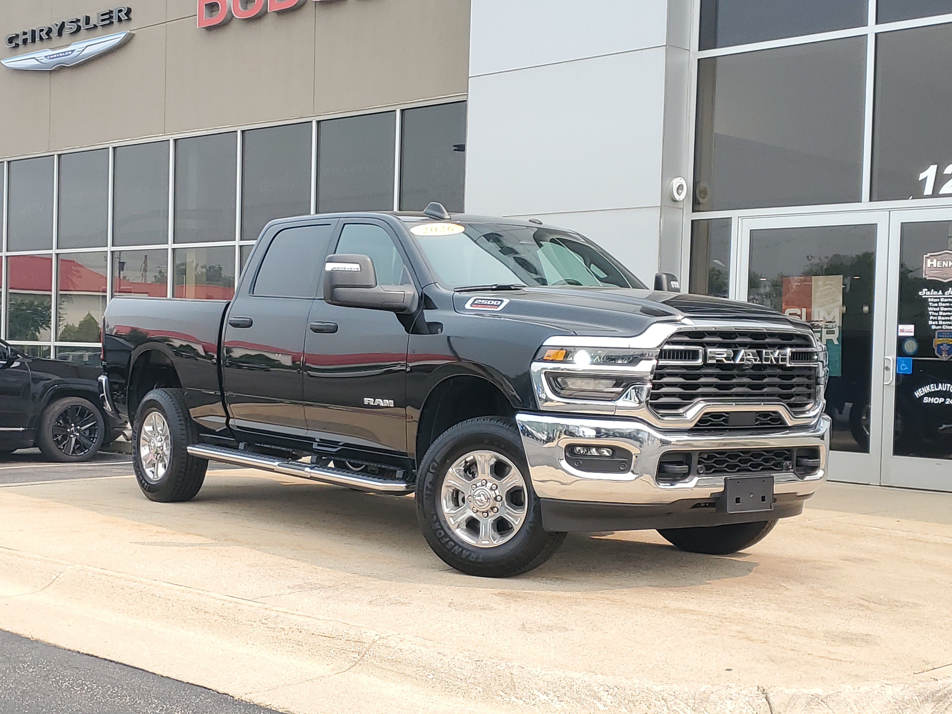 2026 RAM 2500 Big Horn Crew Cab 4x4 6'4' Box in Diamond Black Crystal Pearlcoat — front three-quarter view
