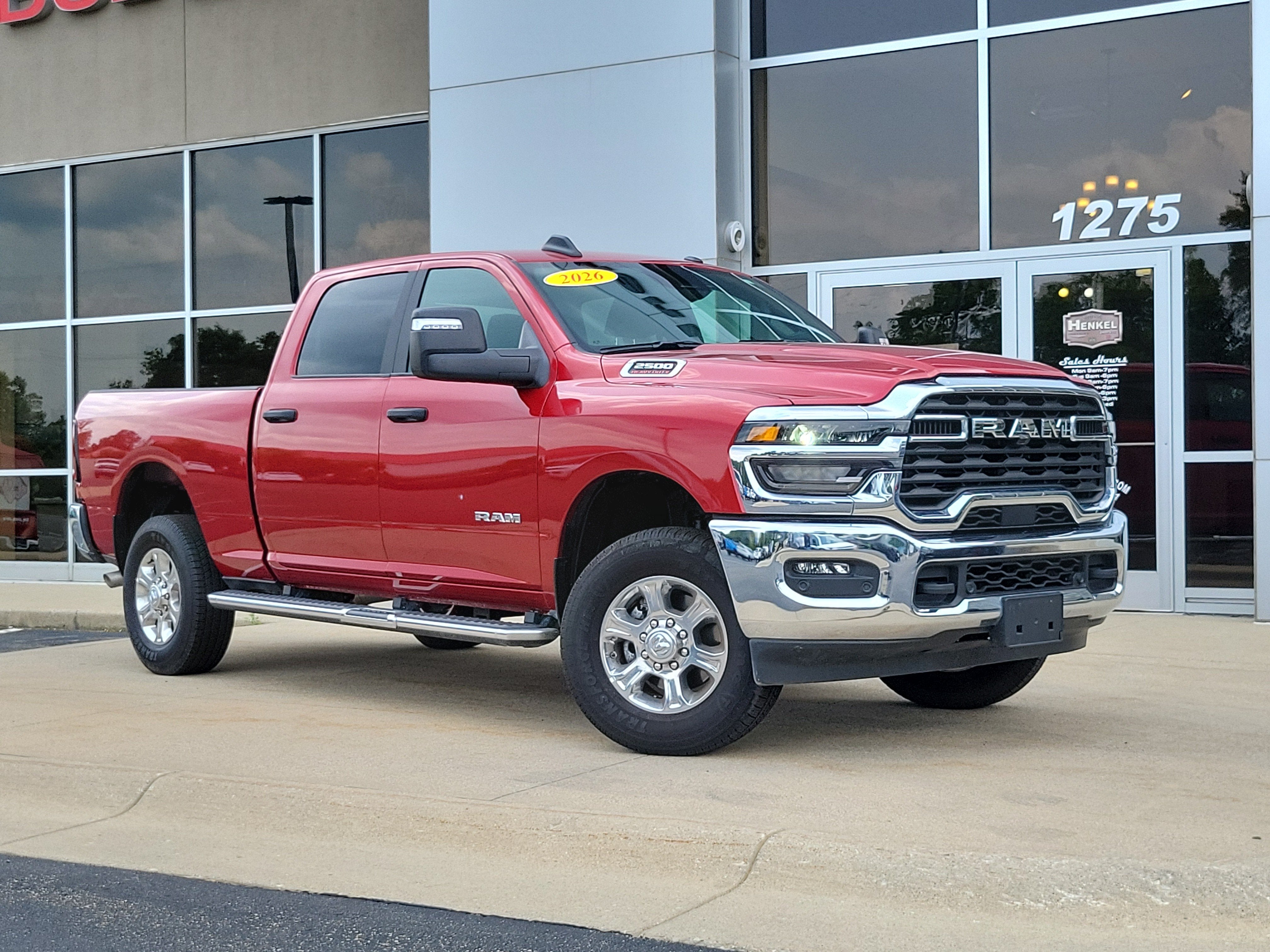 2026 RAM 2500 Big Horn Crew Cab 4x4 6'4' Box in Molten Red Pearlcoat — front three-quarter view