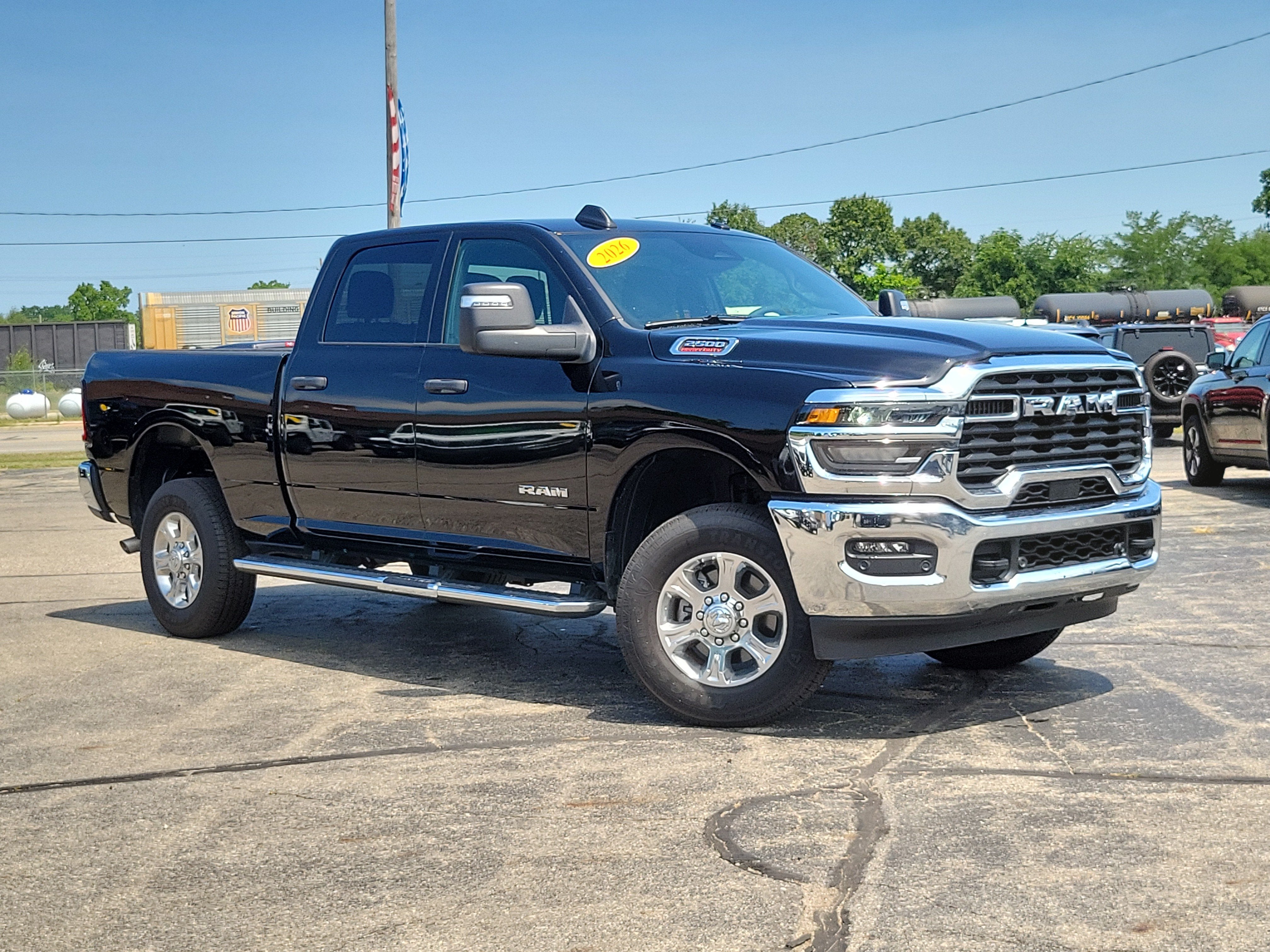 2026 RAM 2500 Big Horn Crew Cab 4x4 6'4' Box in Diamond Black Crystal Pearlcoat — front three-quarter view