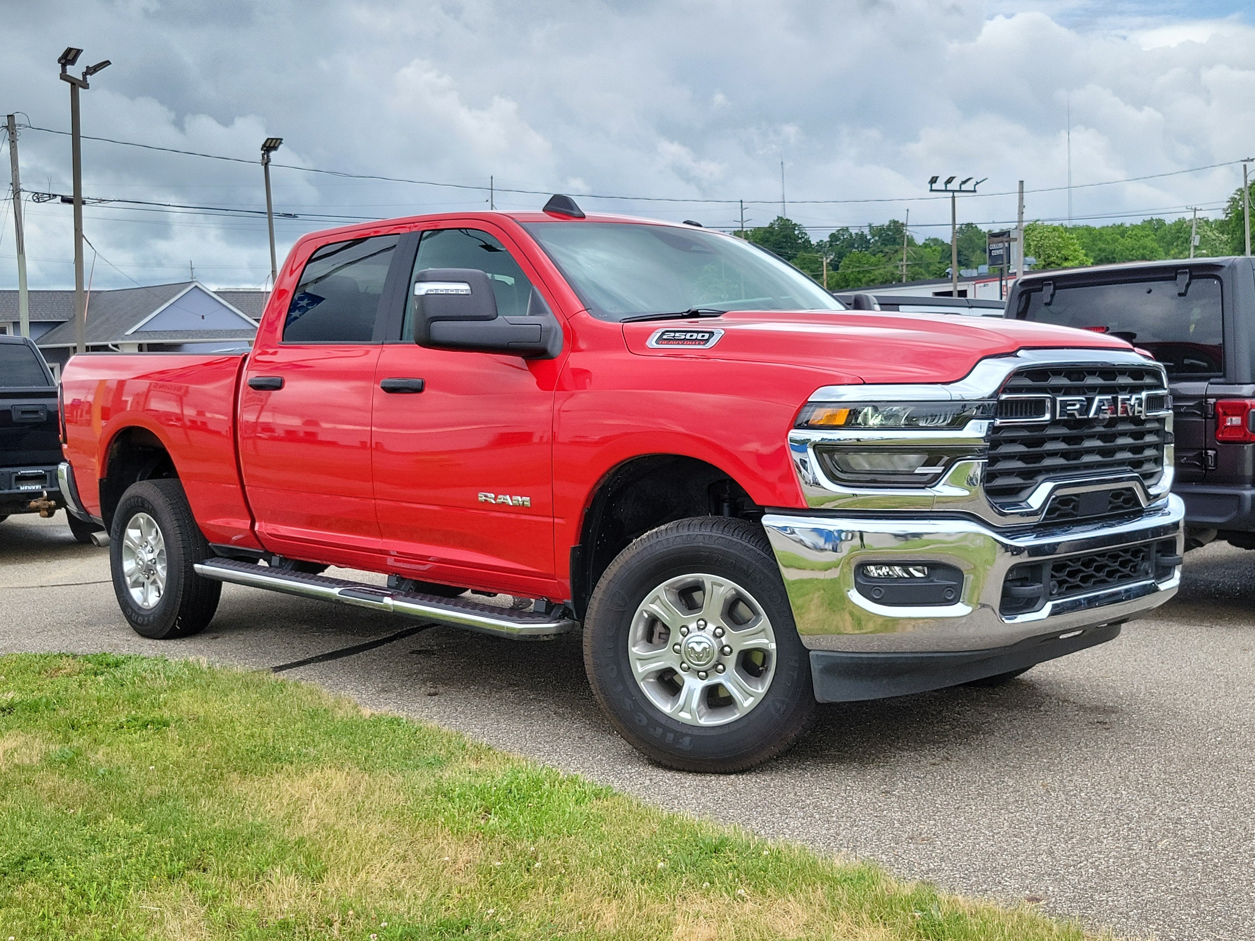 2026 RAM 2500 Big Horn Crew Cab 4x4 6'4' Box in Flame Red Clearcoat — front three-quarter view