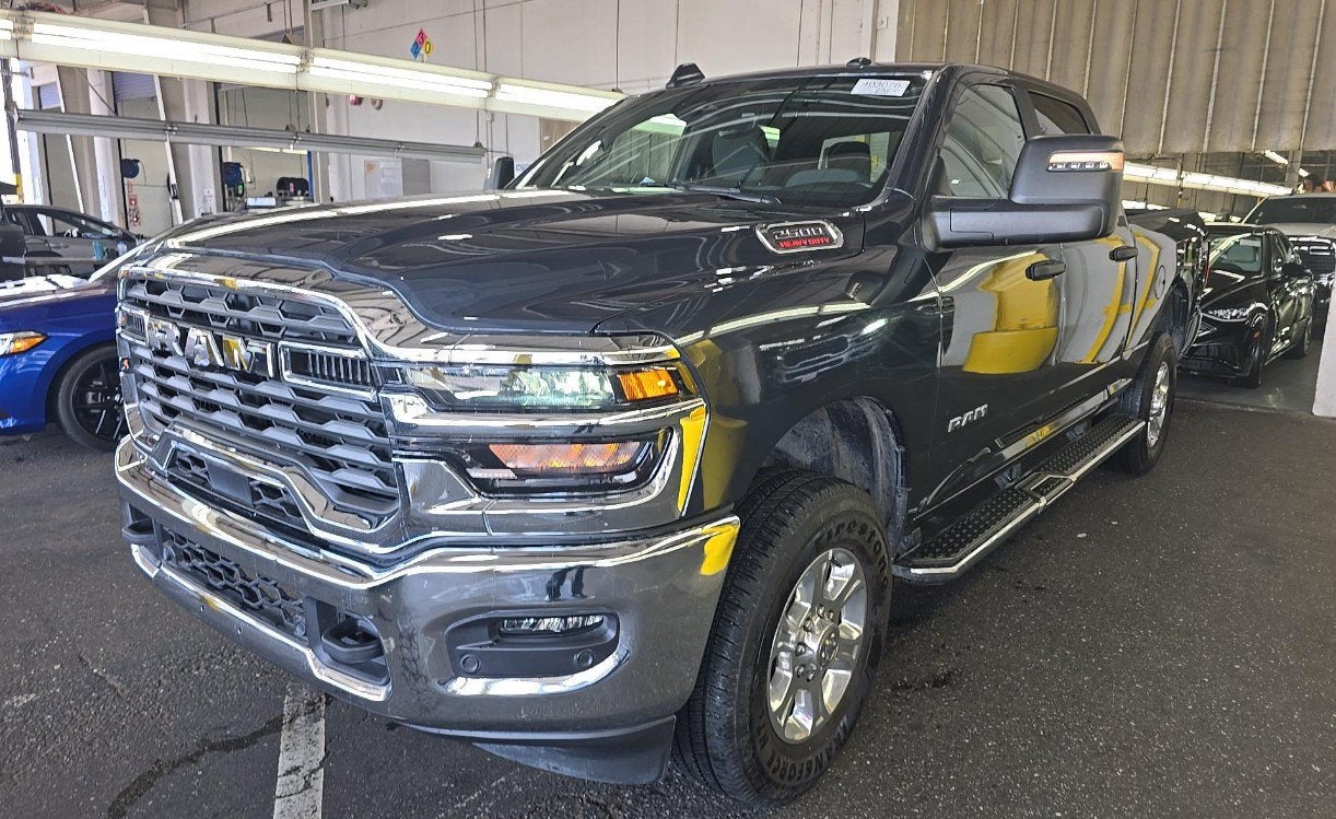 2025 RAM 2500 Big Horn Crew Cab 4x4 6'4' Box in Forged Blue Metallic — front three-quarter view
