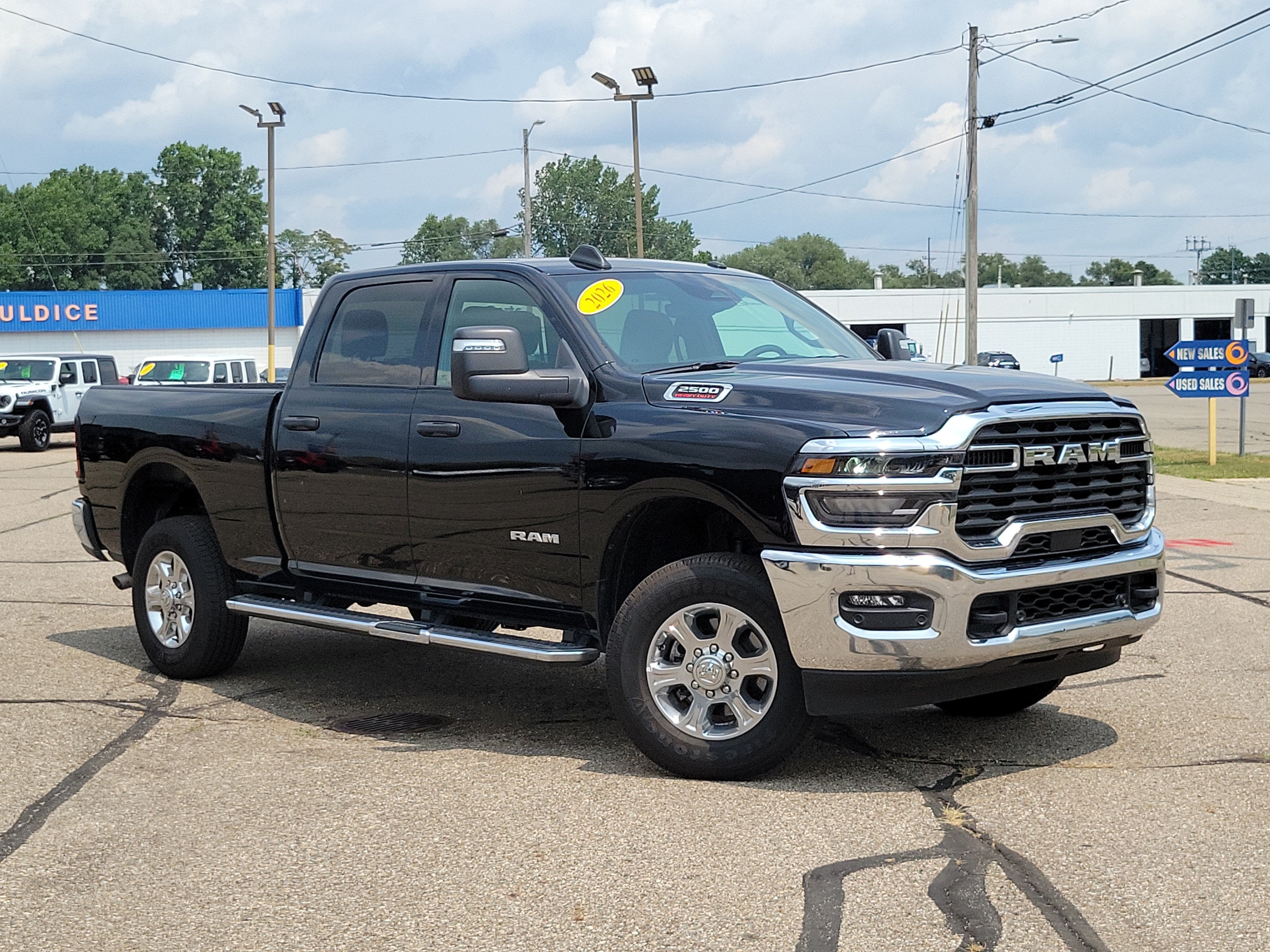 2026 RAM 2500 Big Horn Crew 4x4 in Diamond Black Crystal Pearlcoat — front three-quarter view
