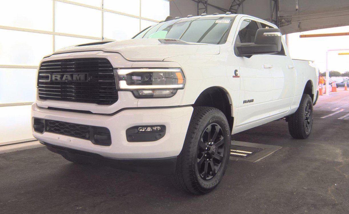 2024 RAM 2500 Laramie Crew Cab 4x4 6'4' Box in Bright White Clearcoat — front three-quarter view