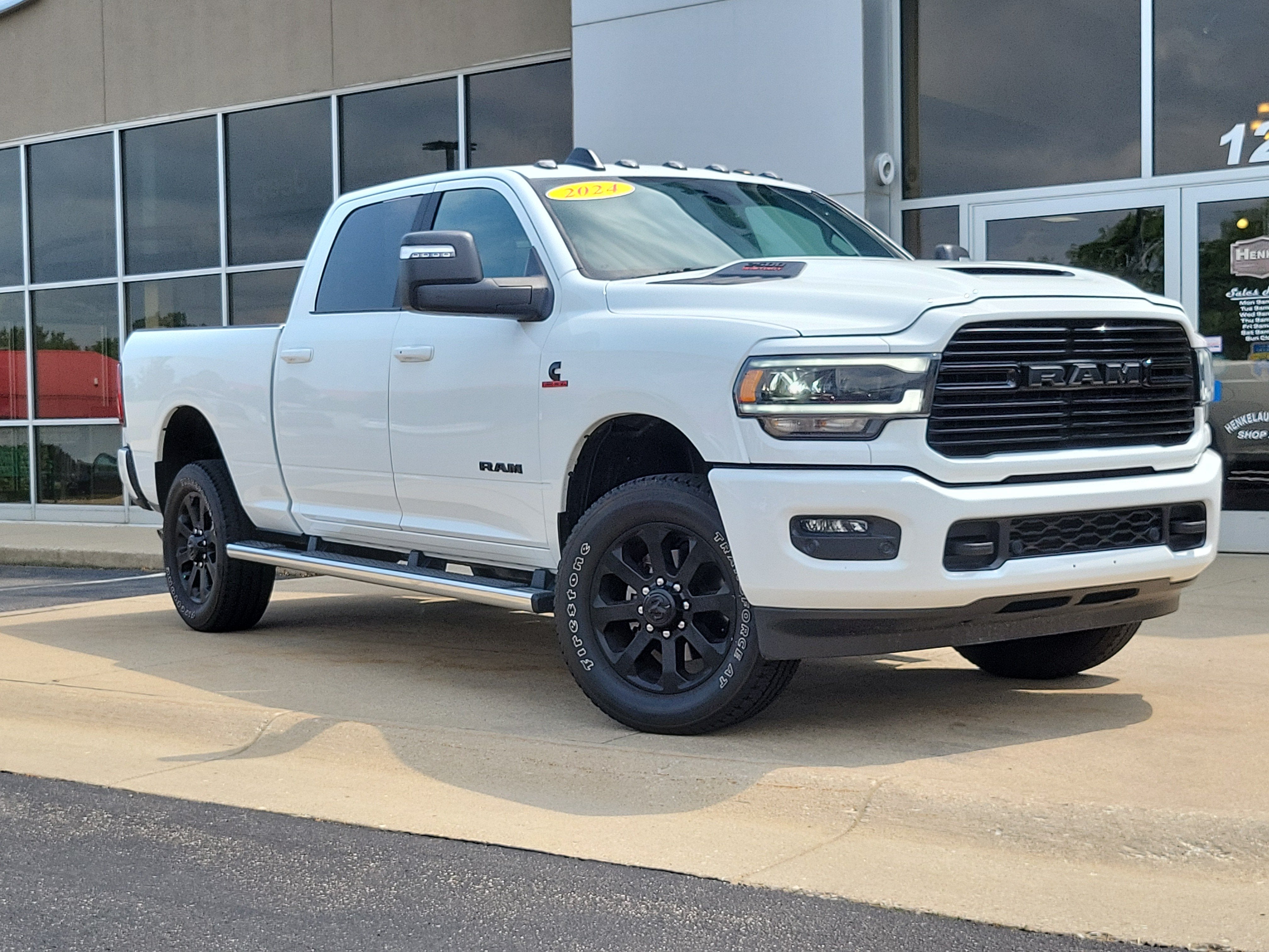 2024 RAM 2500 Laramie Crew Cab 4x4 6'4' Box in Bright White Clearcoat — front three-quarter view